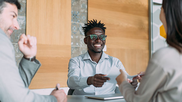 Shot of group of business people in a business meeting.