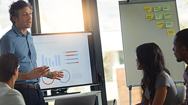 Team lead presenting at a dashboard reporting meeting