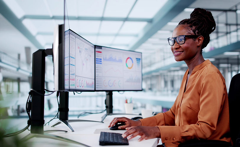 Employee at work station reviewing analytics