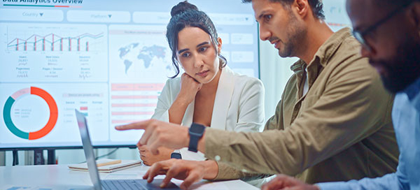 Marketing agency team reviews analytics of a client