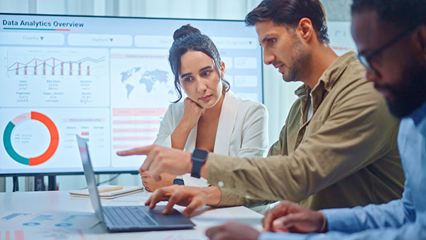 Marketing agency team reviews analytics of a client